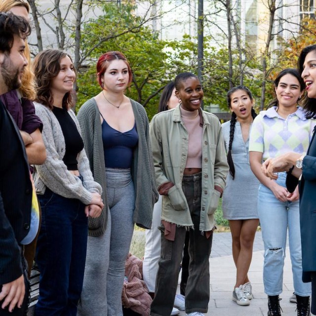 students outside listening to lecture