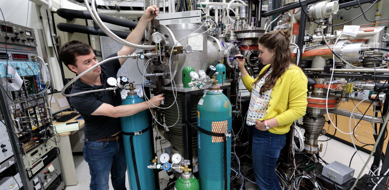 two technicians working on equipment